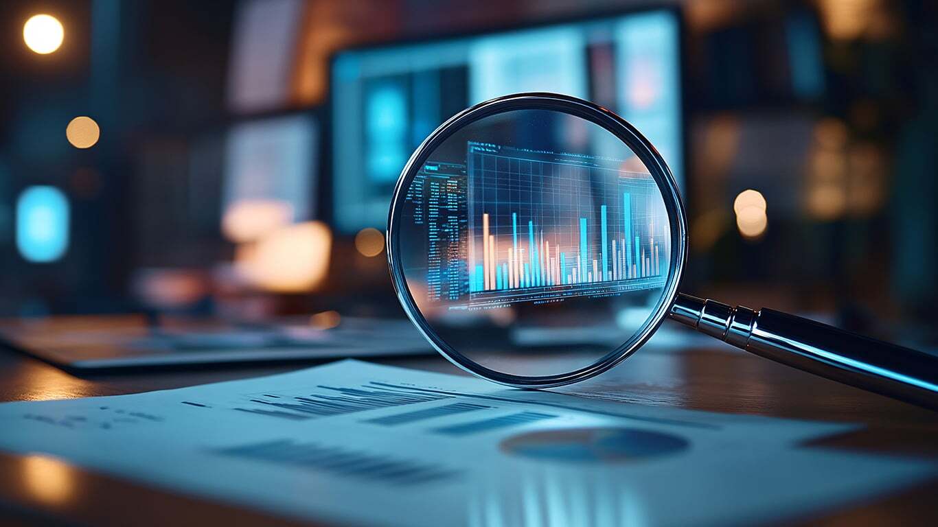magnifying glass with graphs of data and analytics AdobeStock 1048193015